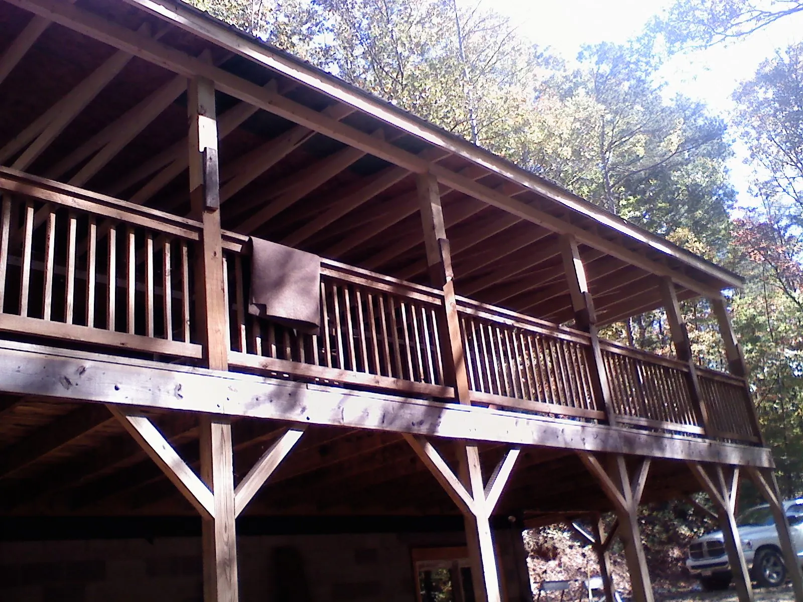 Timber framing under a new elevated porch and deck — Roof Leak Repair in Modesto by Roofing Brothers